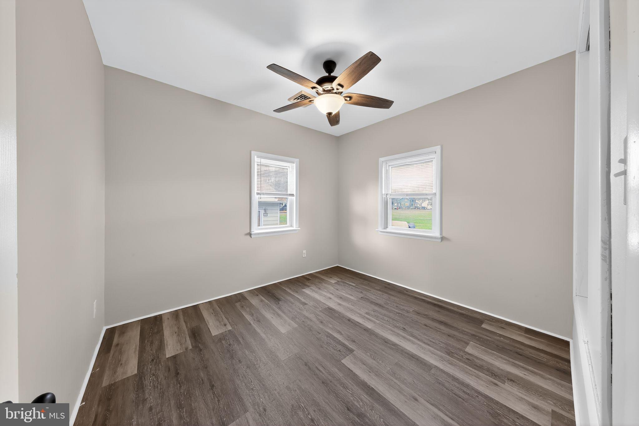 121 Ash Street Carneys Point, NJ 08069 - Photo 18 of 30 wooden floor in an empty room with a window