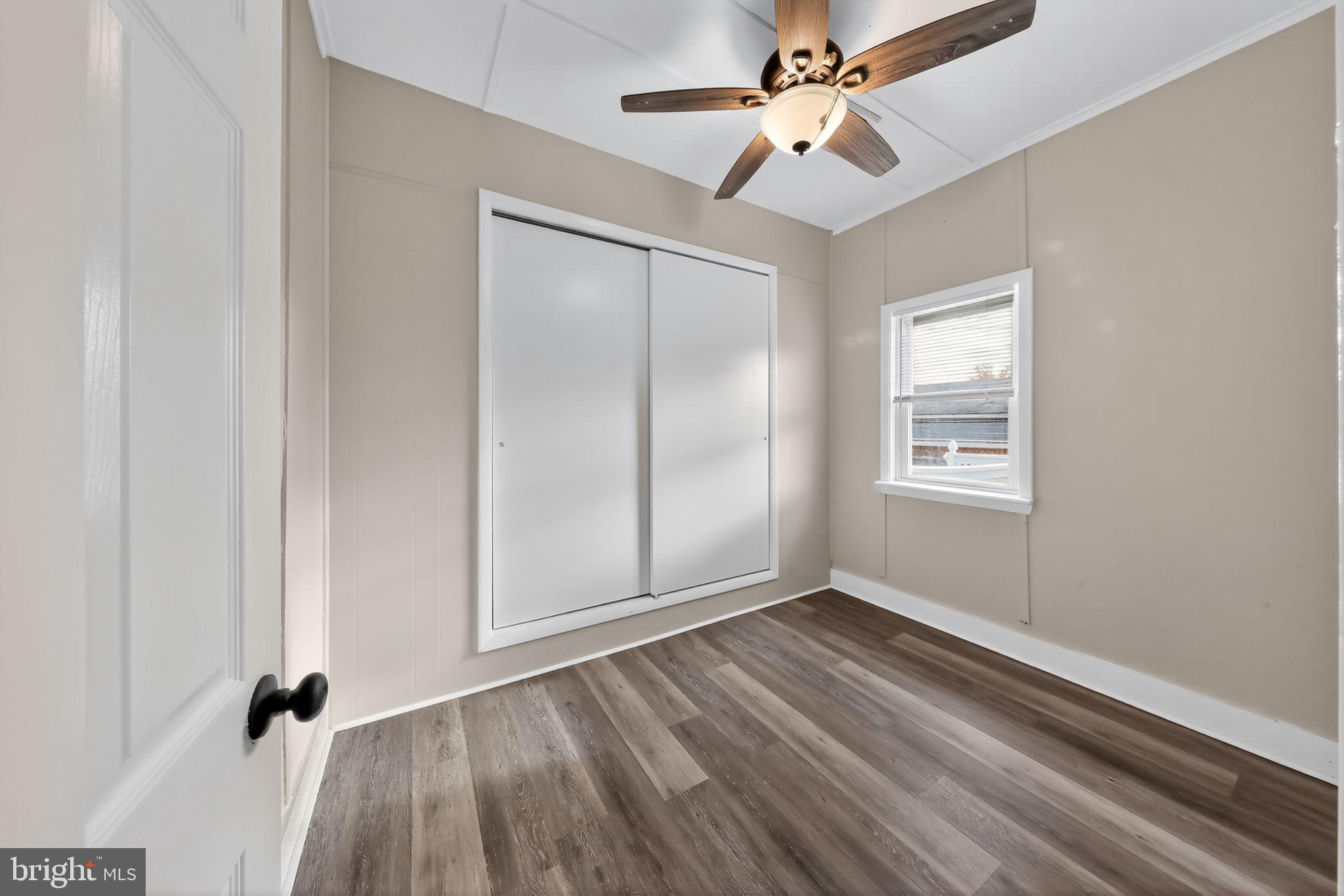 121 Ash Street Carneys Point, NJ 08069 - Photo 20 of 30 wooden floor in an empty room with a window