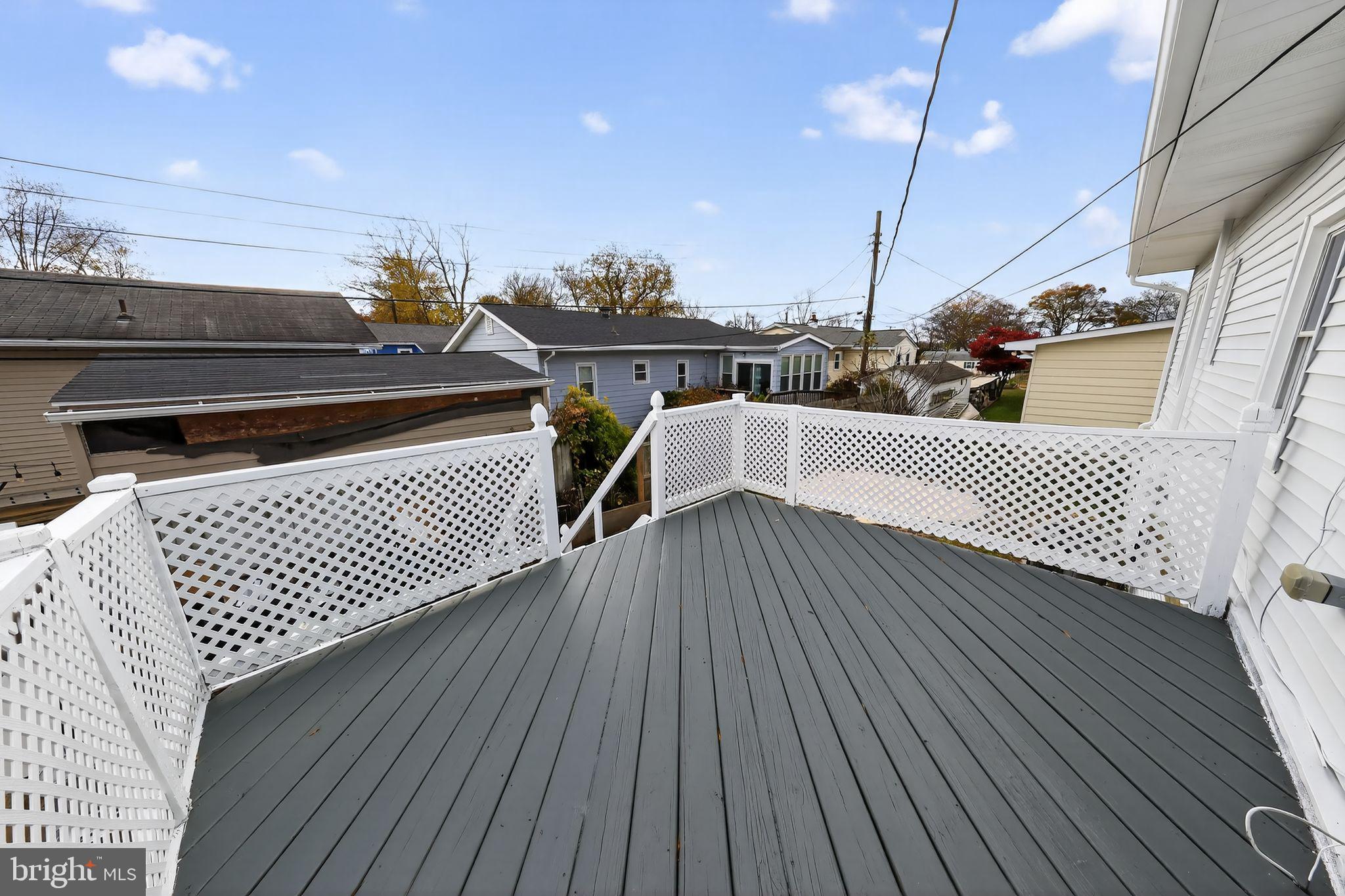 121 Ash Street Carneys Point, NJ 08069 - Photo 29 of 30 a roof deck with a potted plant on a wooden floor