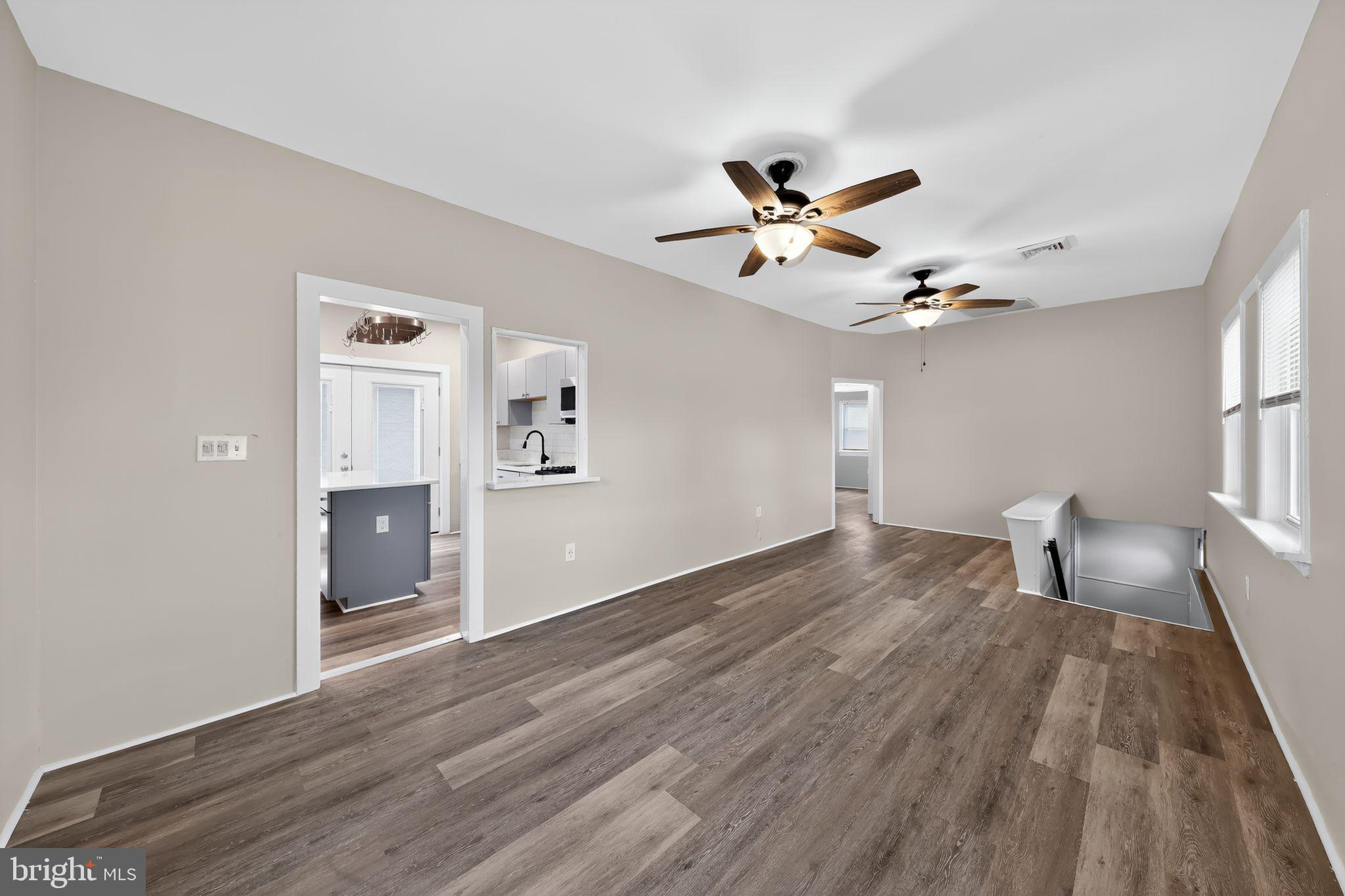 121 Ash Street Carneys Point, NJ 08069 - Photo 7 of 30 a view of empty room with wooden floor and fan