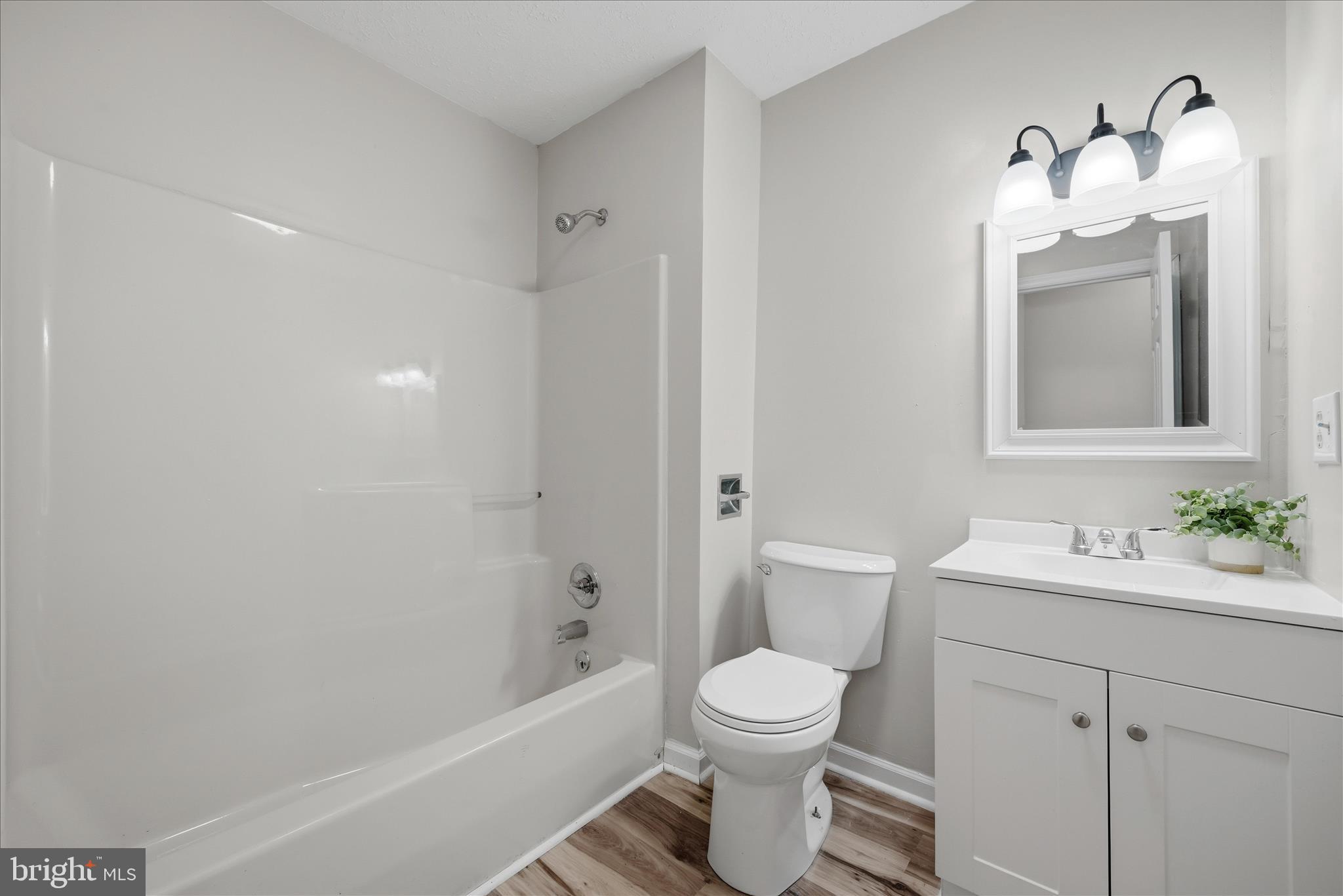 2280 Pine Grove Road Berkeley Springs, WV 25411 - Photo 22 of 59 a bathroom with a toilet a sink and bathtub
