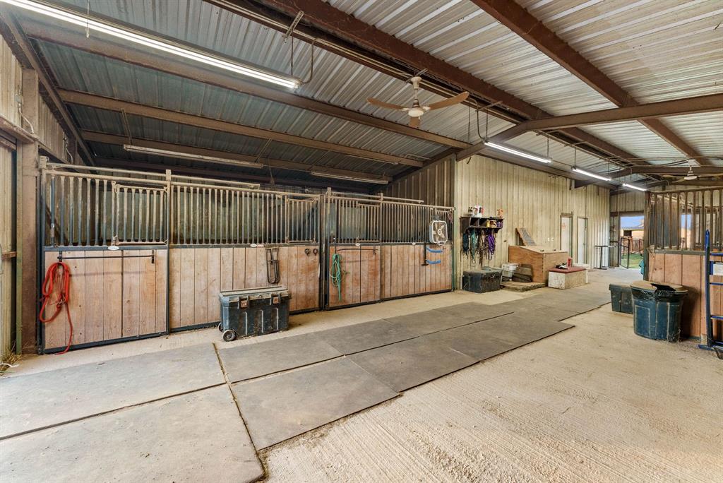 2700 Auction Barn Road Belton, TX 76513 - Photo 31 of 38 a view of a garage with wooden floor