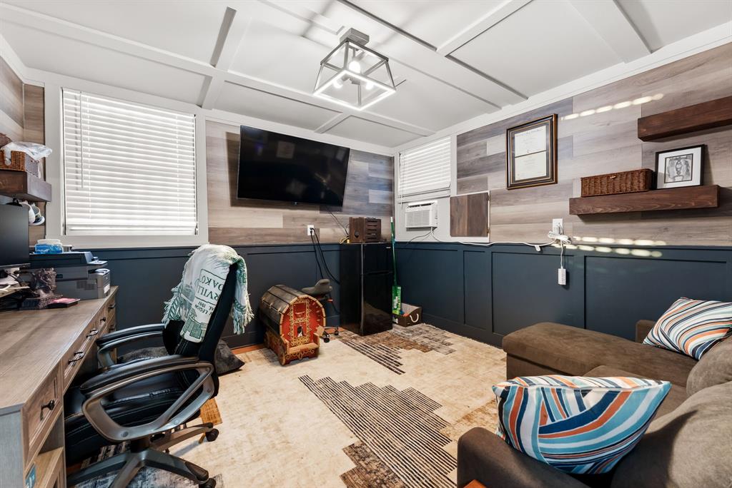 2700 Auction Barn Road Belton, TX 76513 - Photo 32 of 38 a work room with furniture and flat screen tv