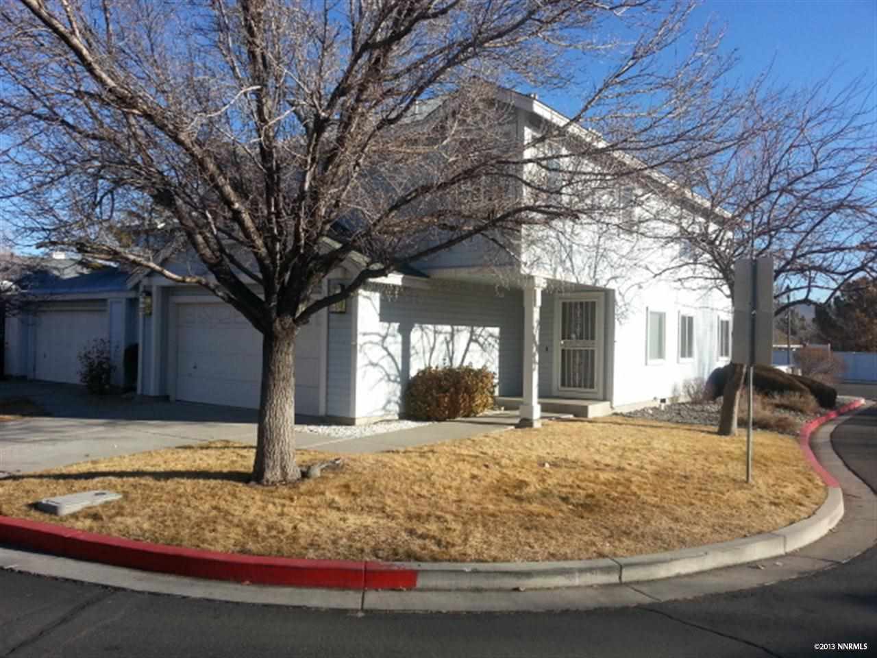 7574 Wheeldale Circle Reno, NV 89511 - Photo 1 of 1 a large tree in front of a house