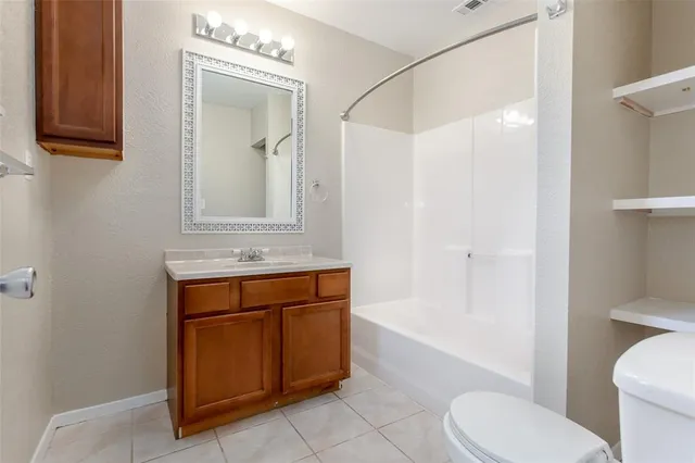 a view of backyard with wooden fence