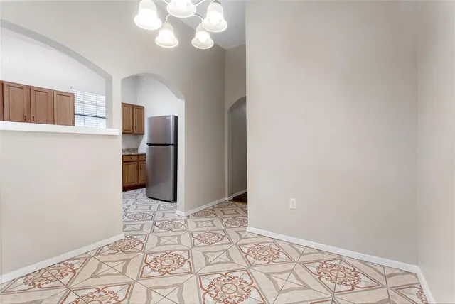 a view of a bedroom with wooden floor and a window