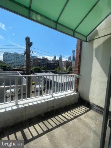 a view of balcony with wooden floor and outdoor space