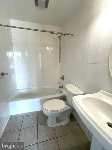 a bathroom with a bathtub and a toilet