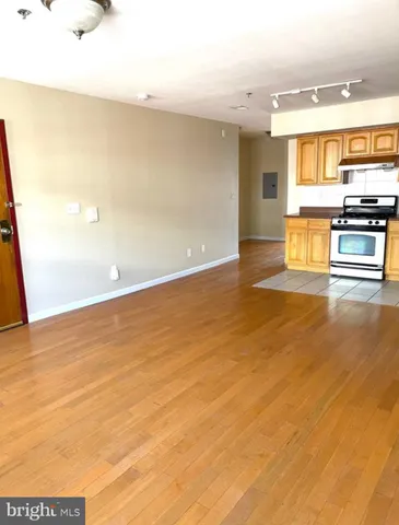 a view of kitchen and empty room