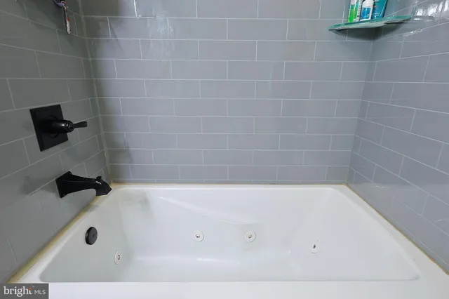 a bed room with a bed and a mirror