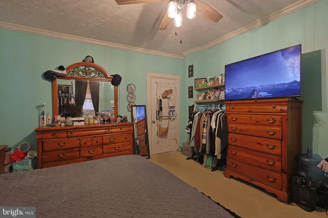 a bedroom with bed and a window