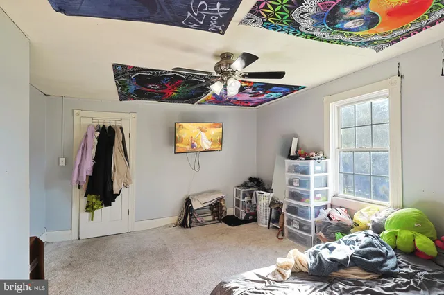 an aerial view of a house with a big yard