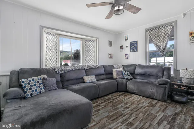 a kitchen with a refrigerator and a stove top oven