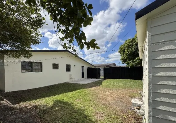 a house view with a backyard space