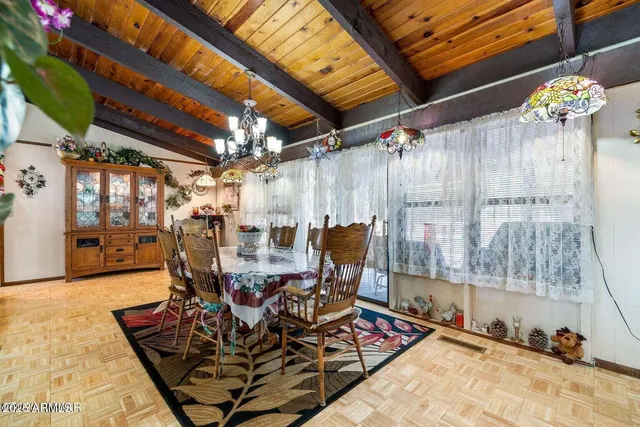 a kitchen with refrigerator and cabinets