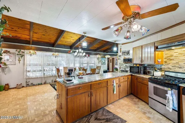 a view of a chairs and tables in a patio
