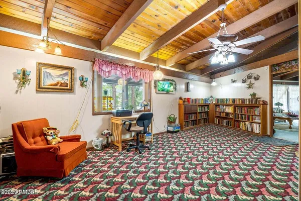 a bedroom with a bed and a tv