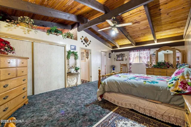 a bathroom with a granite countertop sink mirror vanity and toilet