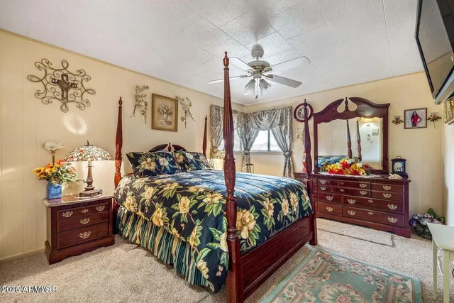 a storage room with water heater and book shelf