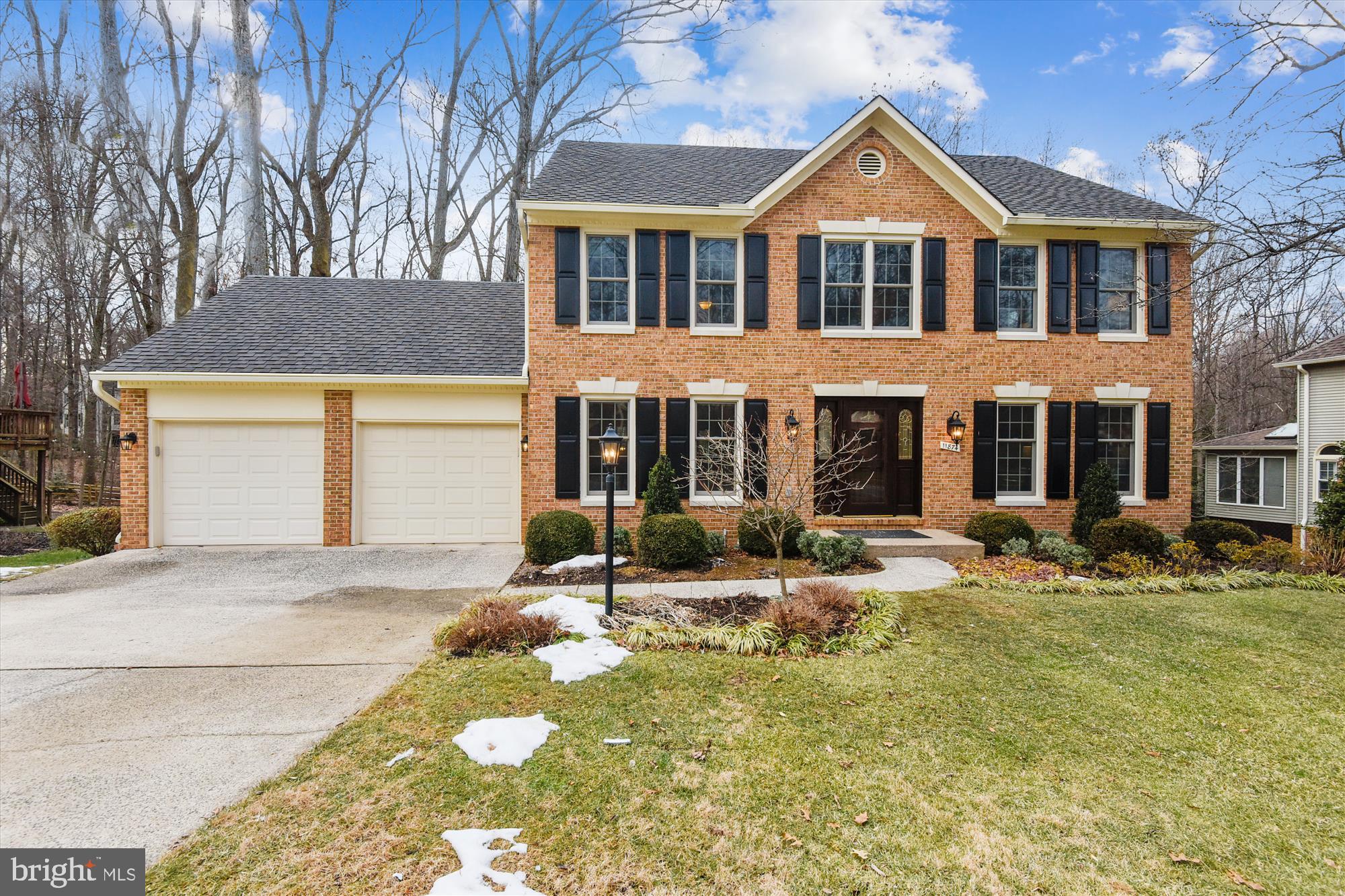 a front view of a house with yard and seating space