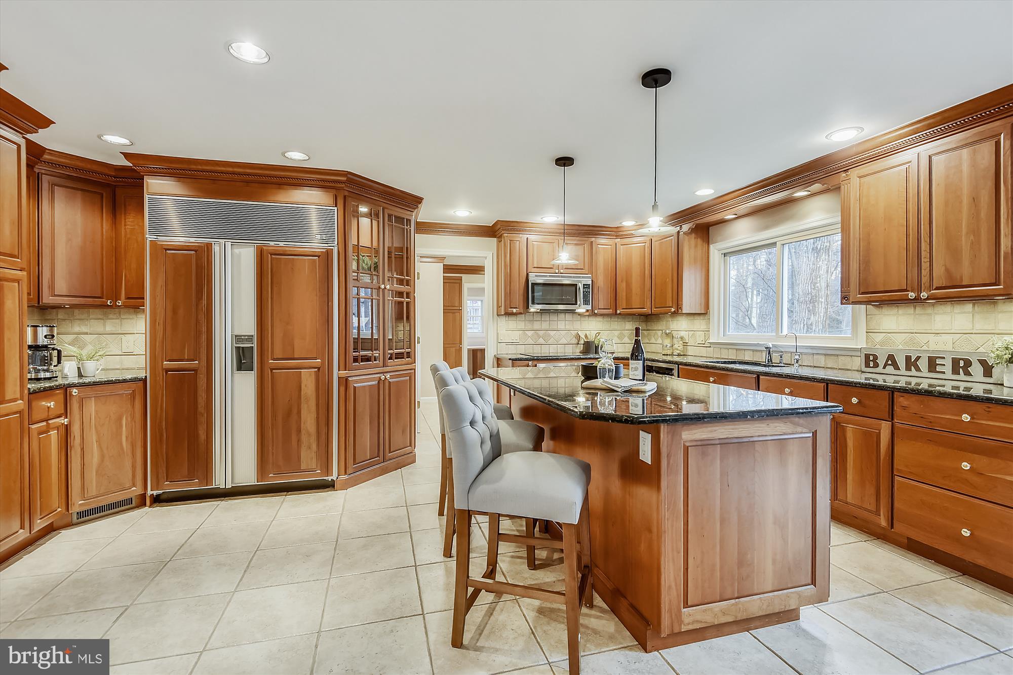 11874 Fawn Ridge Lane Reston, VA 20194 - Photo 13 of 75 a kitchen with granite countertop a sink appliances and cabinets