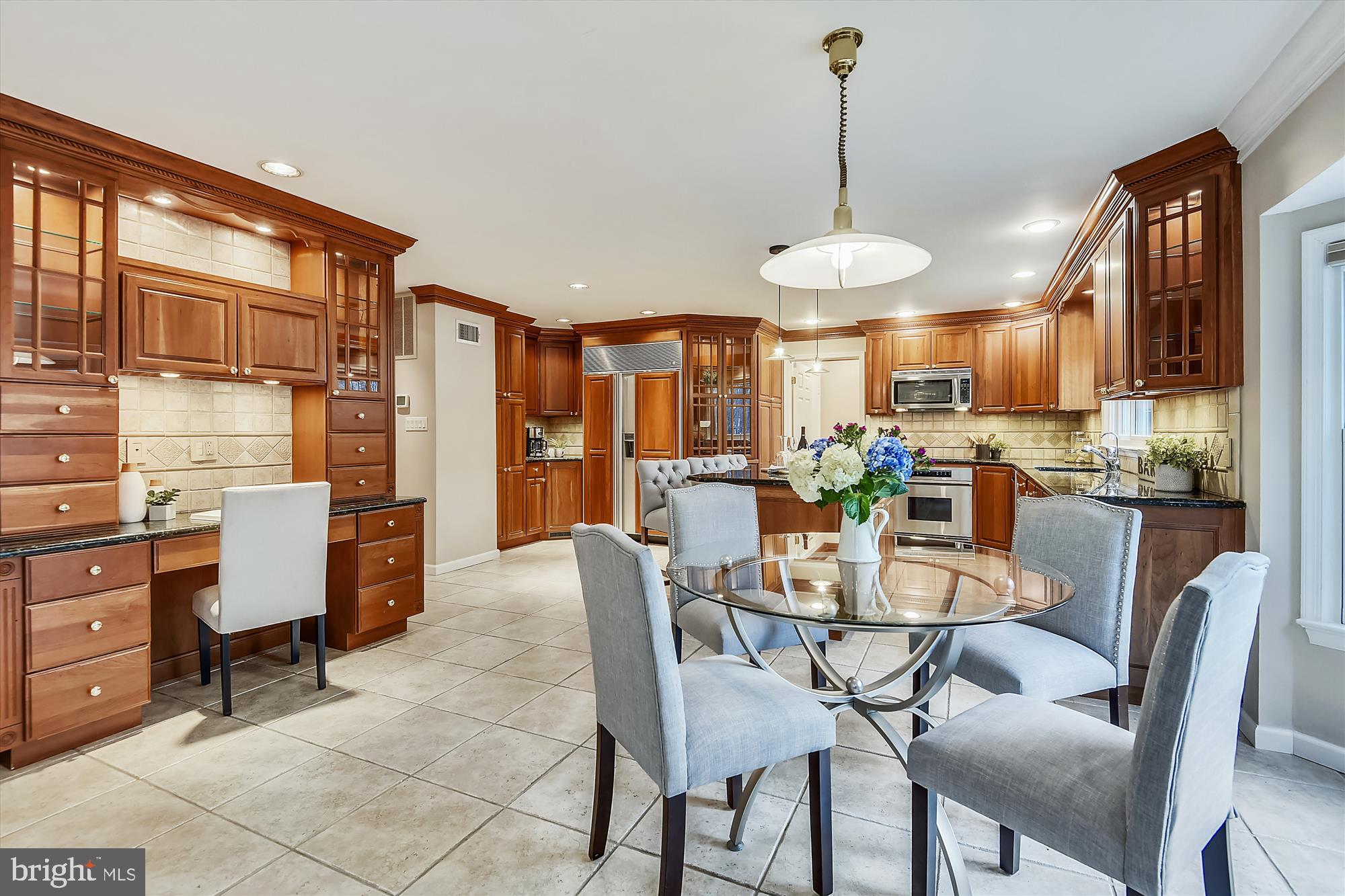 11874 Fawn Ridge Lane Reston, VA 20194 - Photo 15 of 75 a dining room with furniture a chandelier and wooden floor