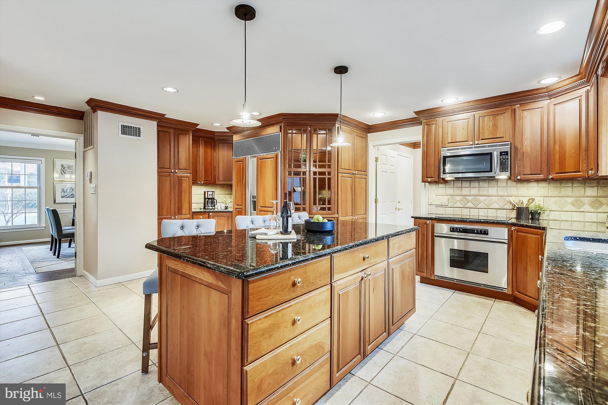 11874 Fawn Ridge Lane Reston, VA 20194 - Photo 17 of 75 a kitchen with stainless steel appliances granite countertop a stove and a sink