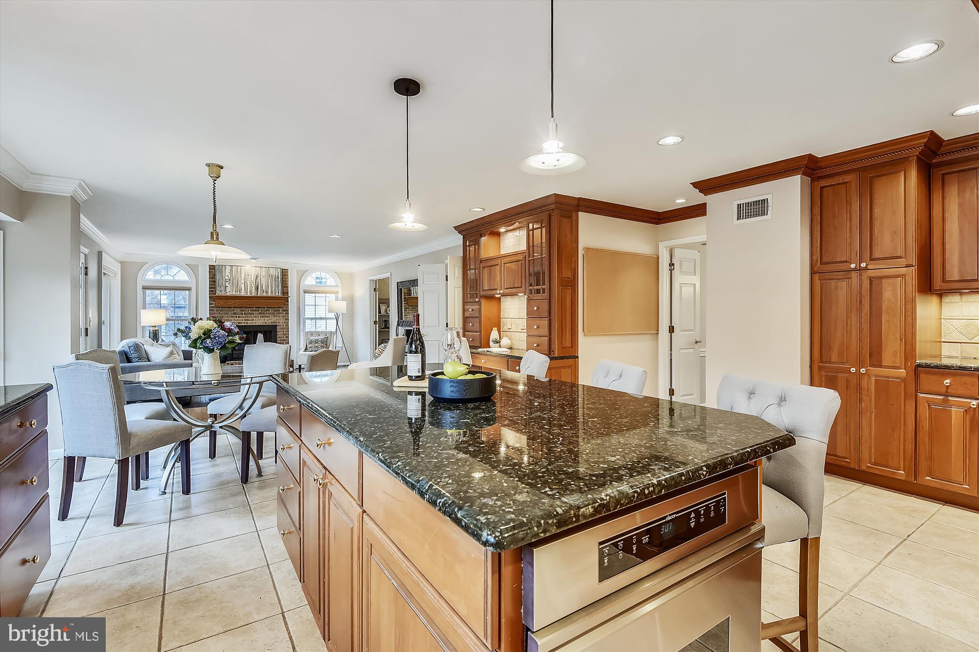 11874 Fawn Ridge Lane Reston, VA 20194 - Photo 18 of 75 a kitchen with stainless steel appliances granite countertop stove top oven dining table and chairs