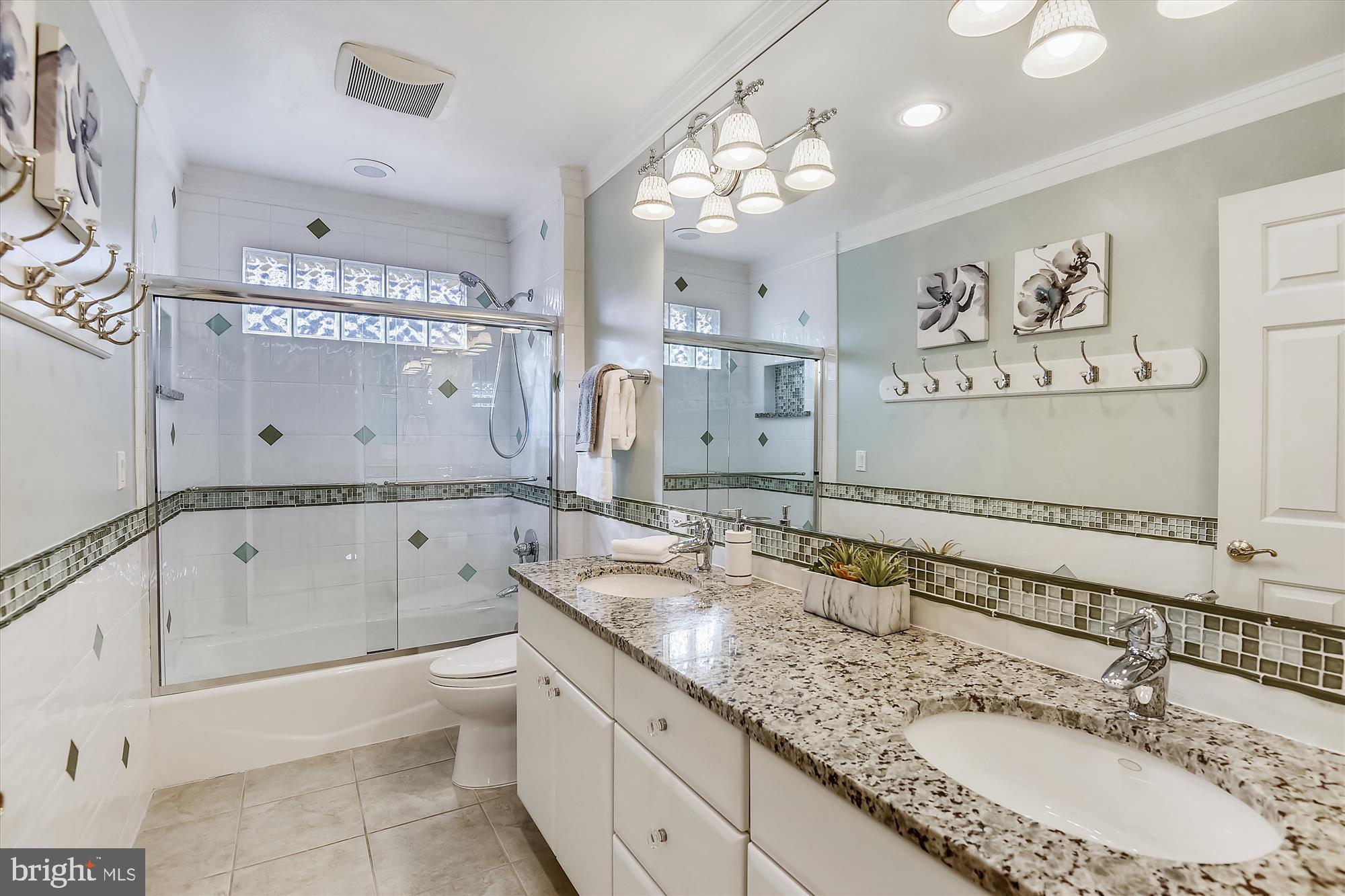 11874 Fawn Ridge Lane Reston, VA 20194 - Photo 31 of 75 a bathroom with a granite countertop double vanity sink mirror double and bathtub