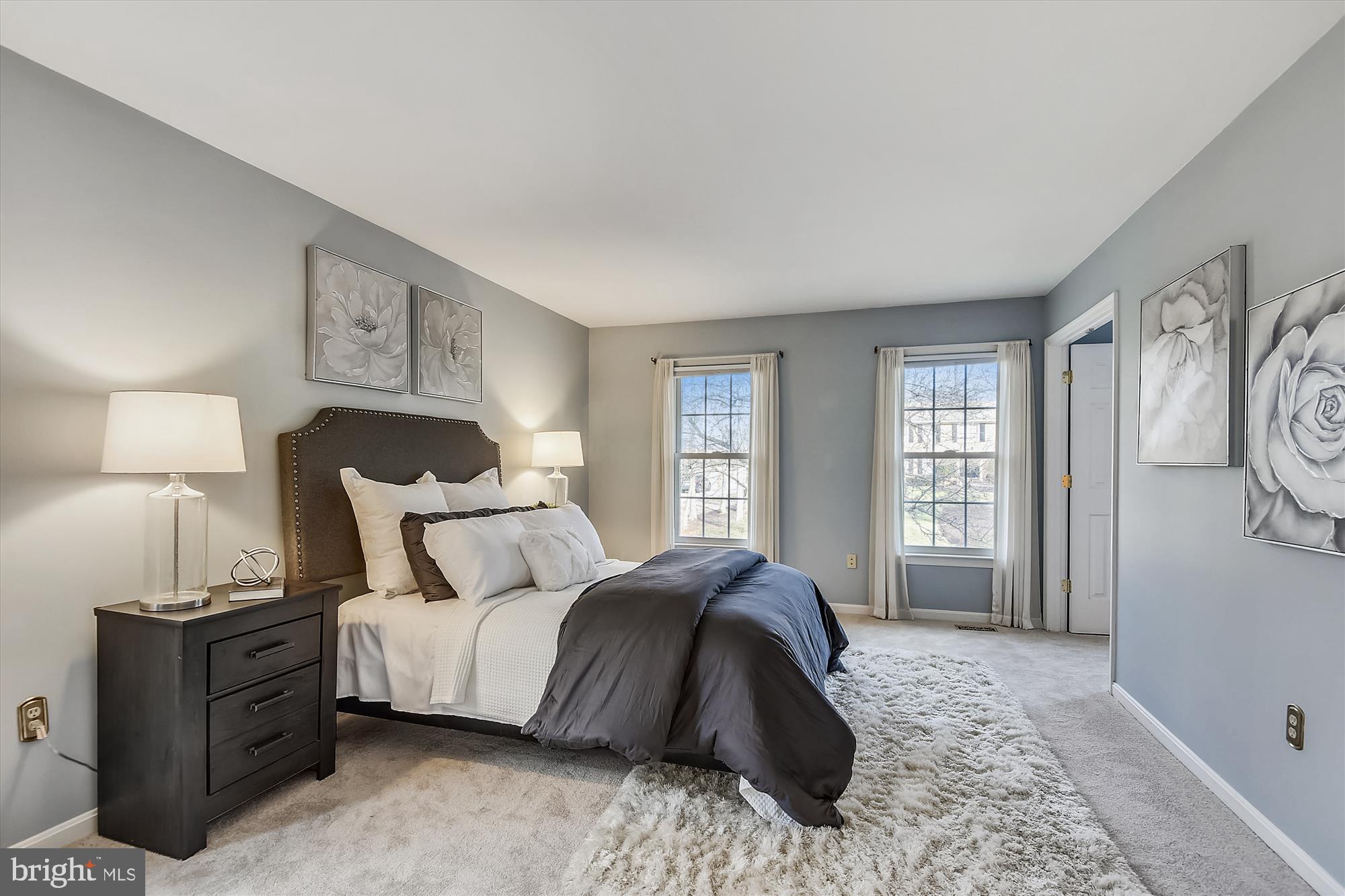 11874 Fawn Ridge Lane Reston, VA 20194 - Photo 39 of 75 a bedroom with a bed and a window