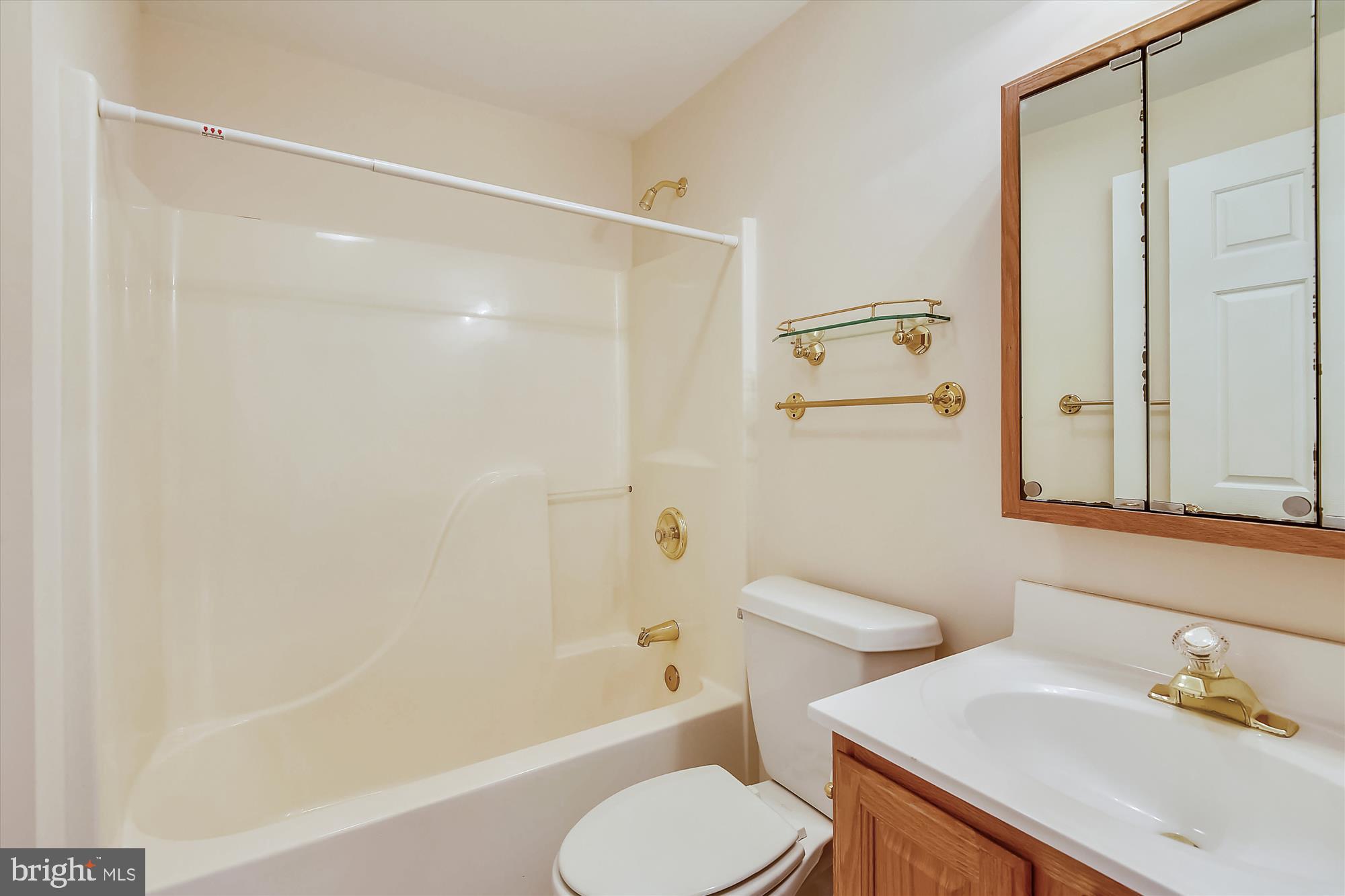 11874 Fawn Ridge Lane Reston, VA 20194 - Photo 55 of 75 a bathroom with a sink toilet and shower