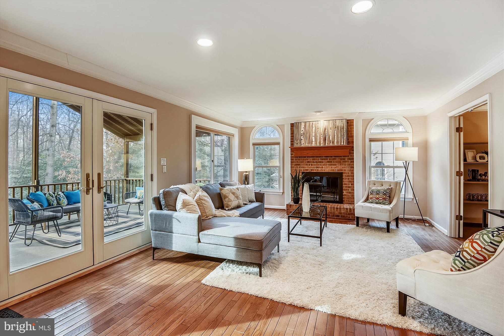 11874 Fawn Ridge Lane Reston, VA 20194 - Photo 7 of 75 a living room with furniture and a fireplace