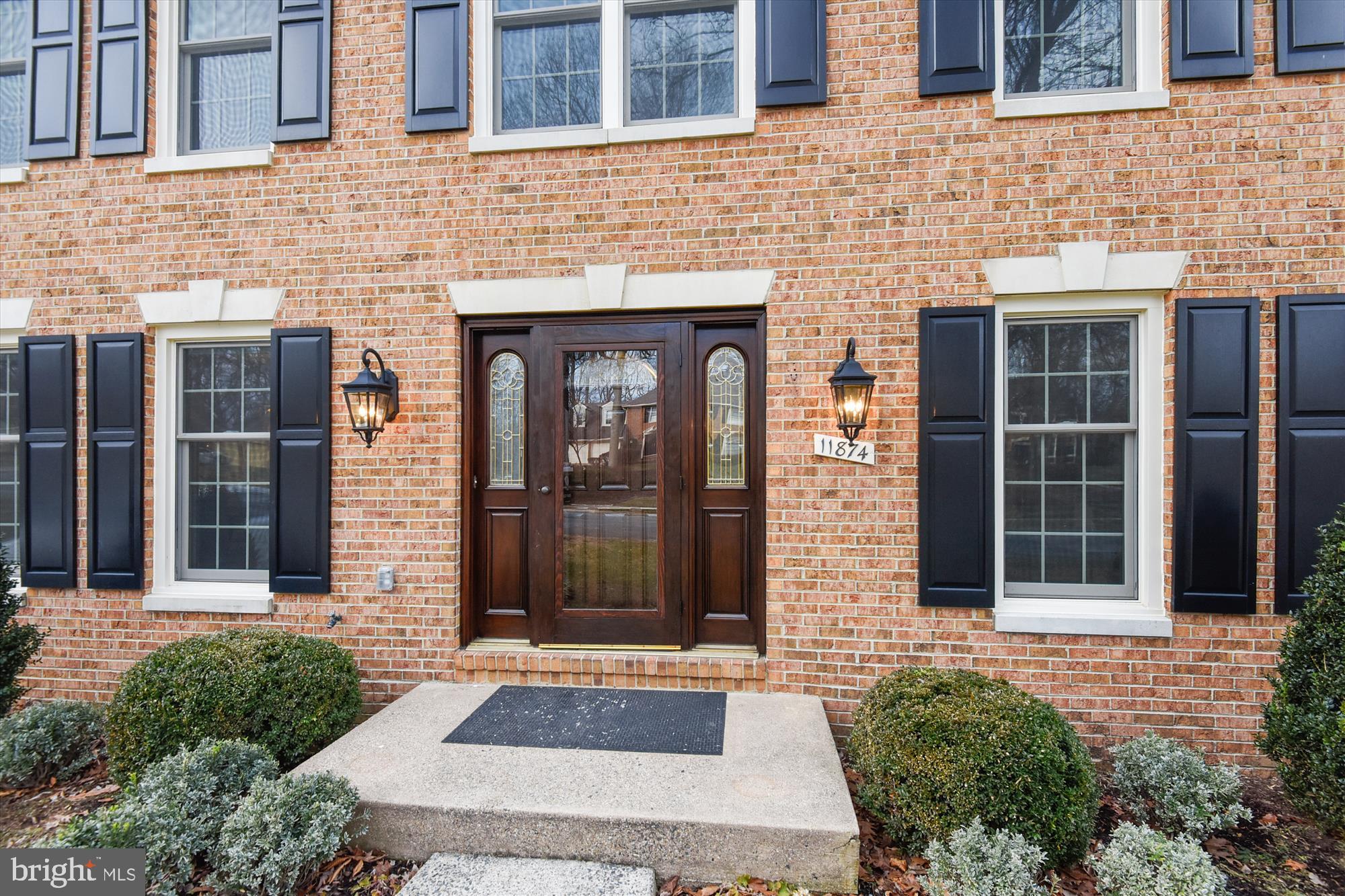 11874 Fawn Ridge Lane Reston, VA 20194 - Photo 75 of 75 a front view of a brick house with a large windows