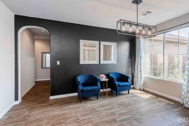 a view of a livingroom with furniture and chandelier