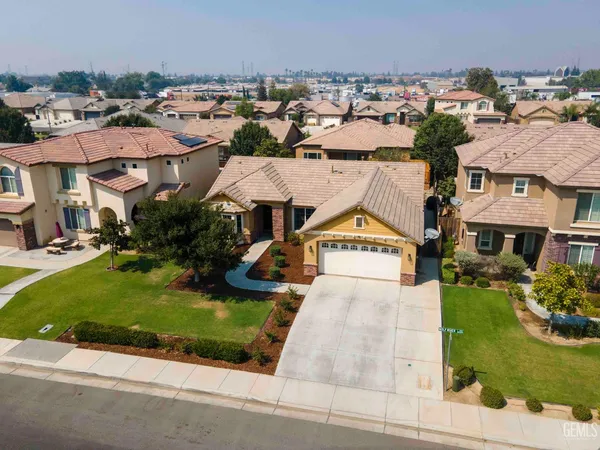 an aerial view of a house with outdoor space
