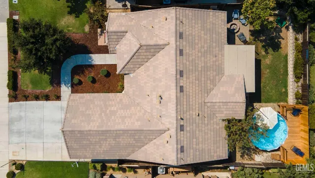 an aerial view of a house with outdoor space