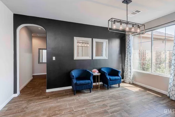 a view of a livingroom with furniture and chandelier