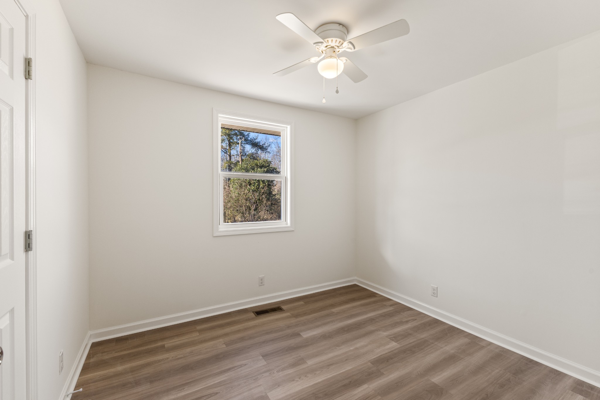 1029 Granada Road Ashland City, TN 37015 - Photo 11 of 34 an empty room with a window and ceiling fan