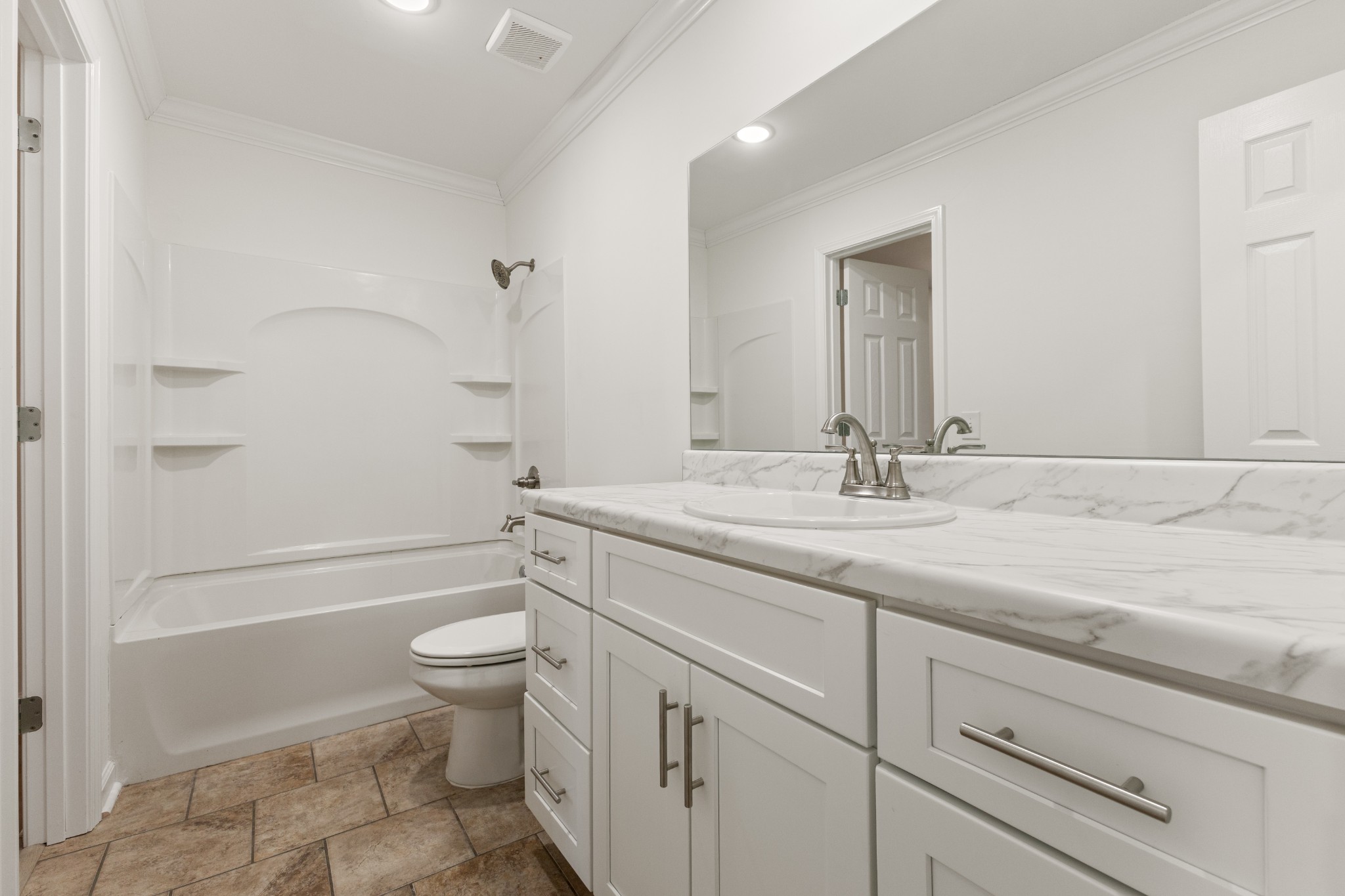 1029 Granada Road Ashland City, TN 37015 - Photo 12 of 34 a bathroom with a granite countertop sink a toilet and shower