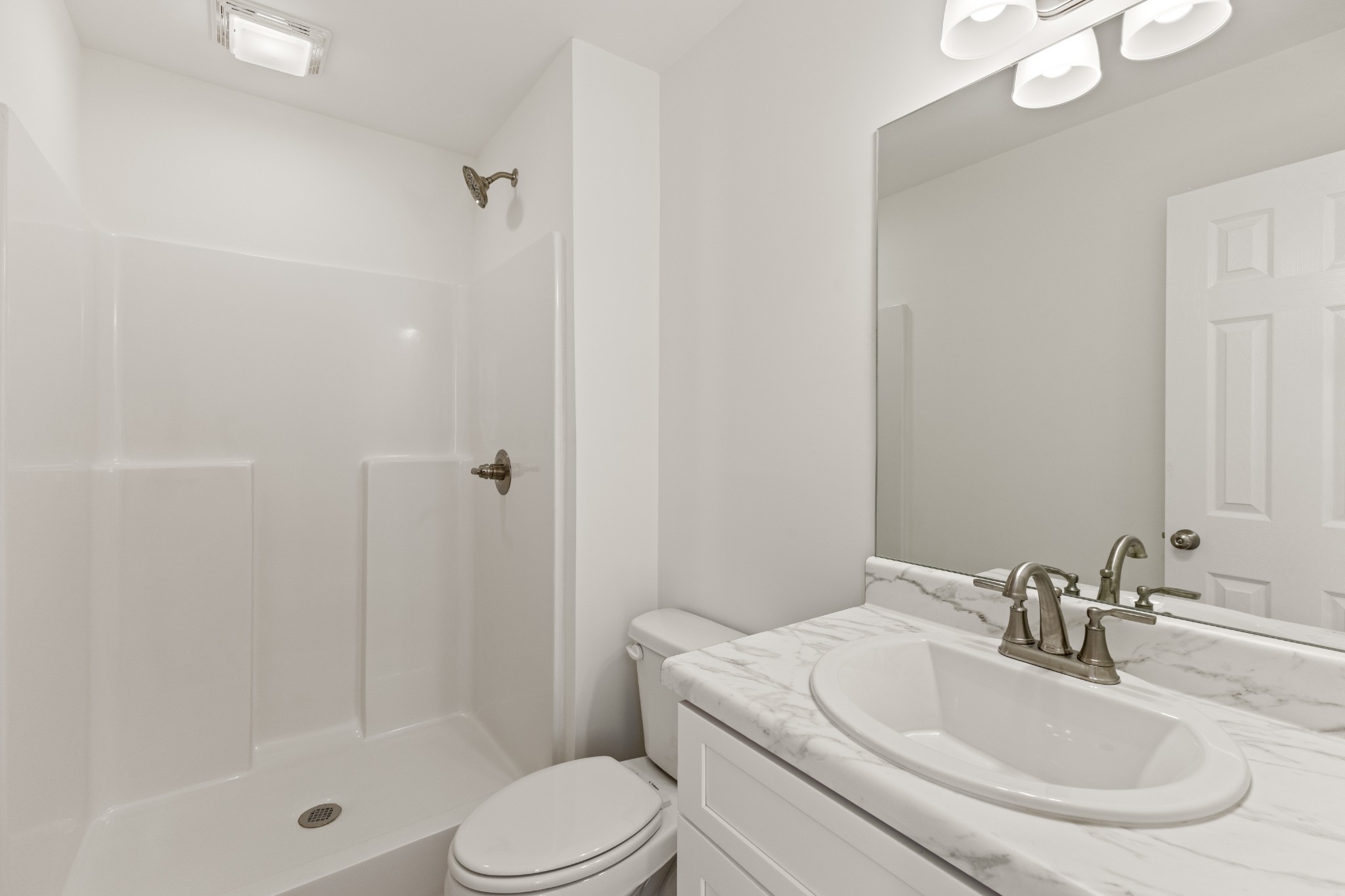 1029 Granada Road Ashland City, TN 37015 - Photo 13 of 34 a bathroom with a sink a toilet and shower
