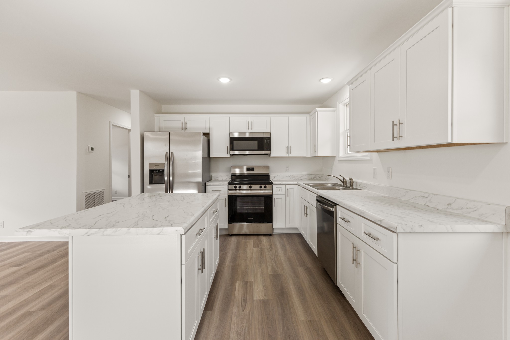 1029 Granada Road Ashland City, TN 37015 - Photo 25 of 34 a kitchen with granite countertop a sink stove and refrigerator