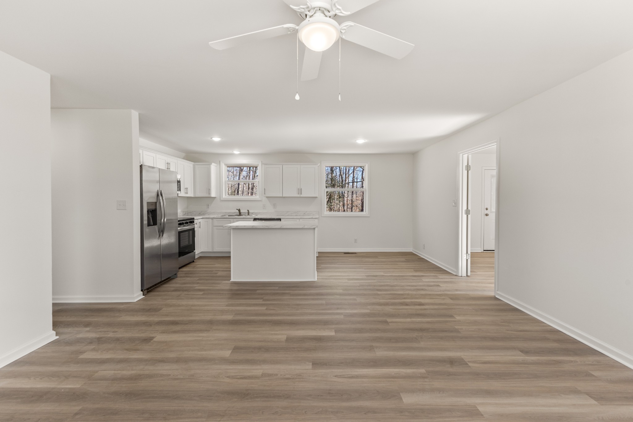 1029 Granada Road Ashland City, TN 37015 - Photo 3 of 34 a view of a kitchen with a sink cabinets and wooden floor