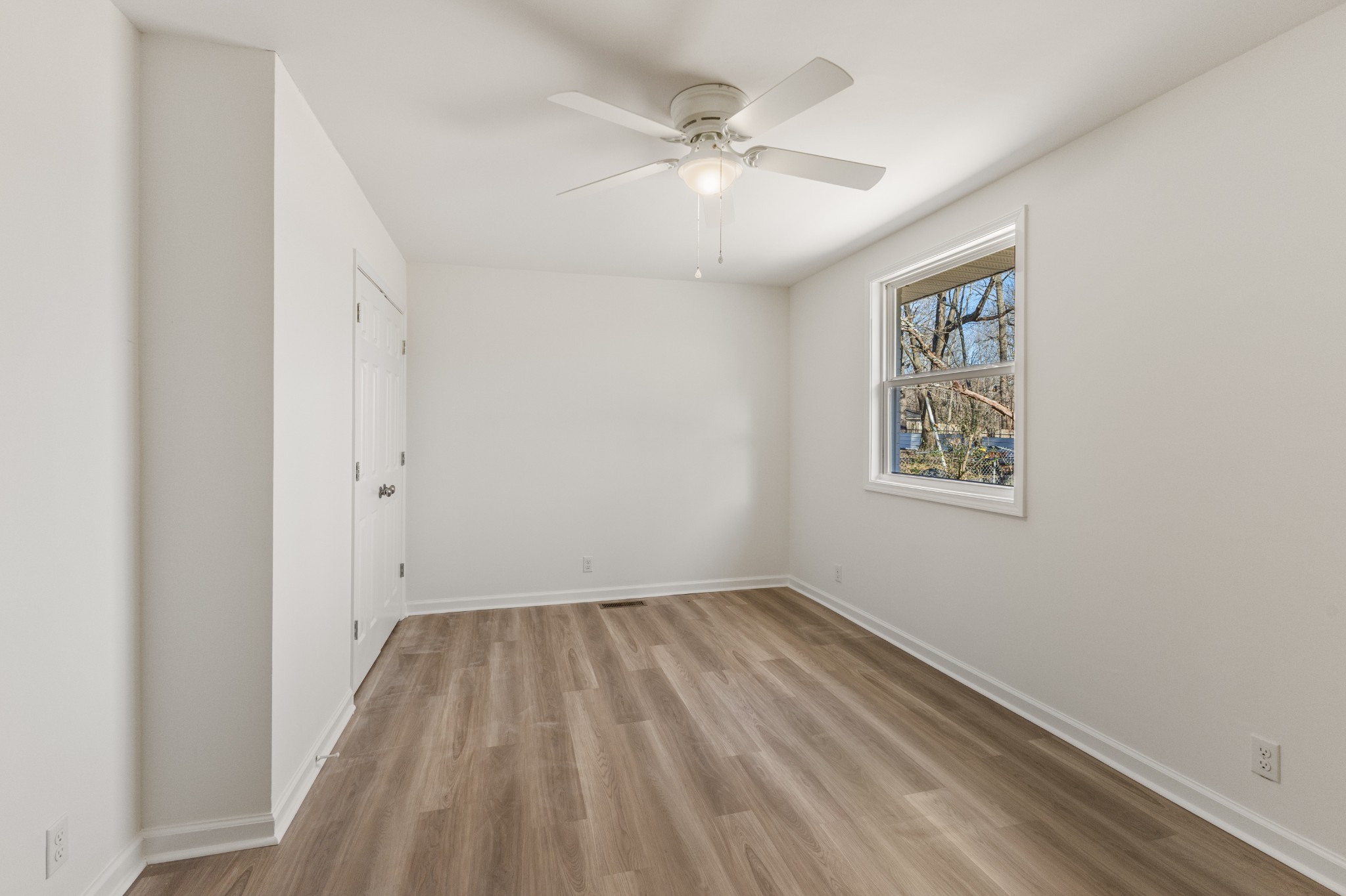 1029 Granada Road Ashland City, TN 37015 - Photo 31 of 34 an empty room with a window and a fan