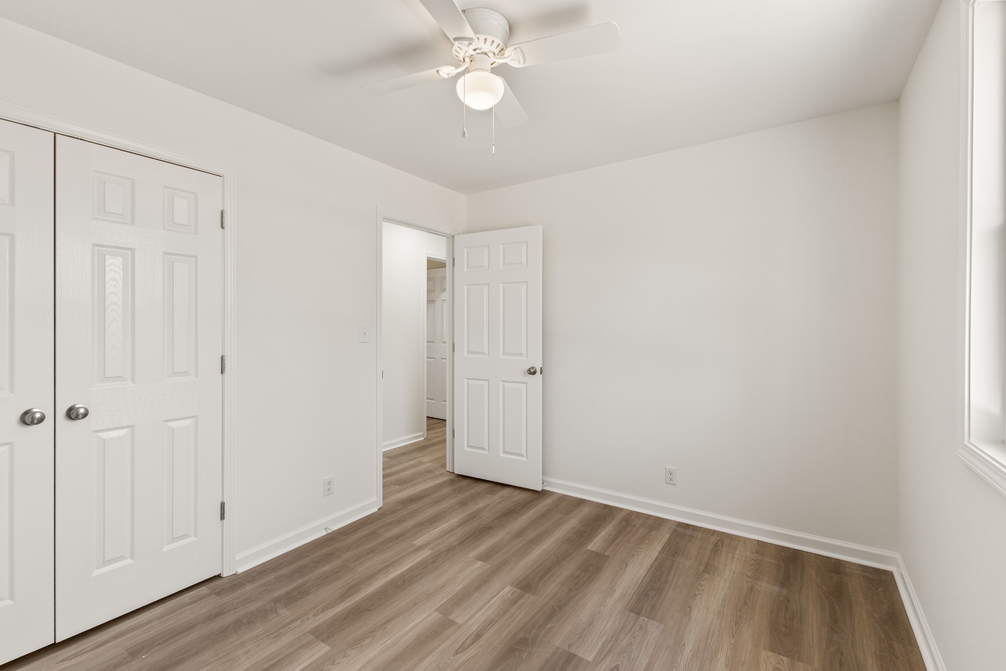 1029 Granada Road Ashland City, TN 37015 - Photo 10 of 34 a view of an empty room with wooden floor