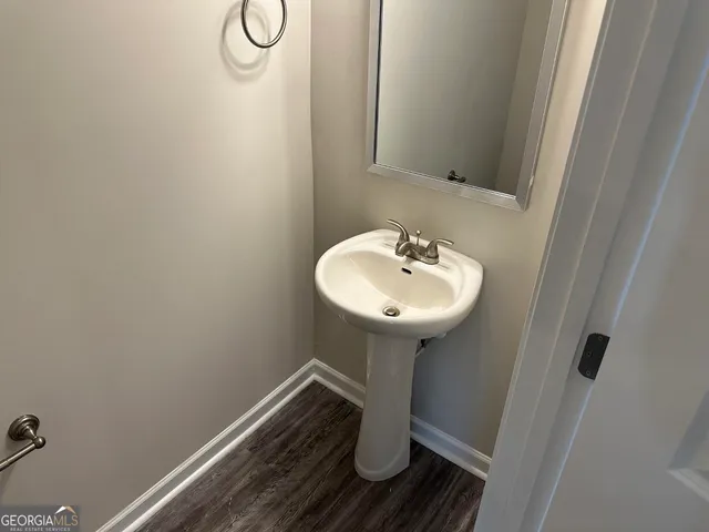 a bathroom with a sink toilet