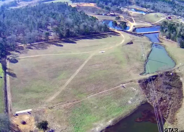 a view of a swimming pool with a yard