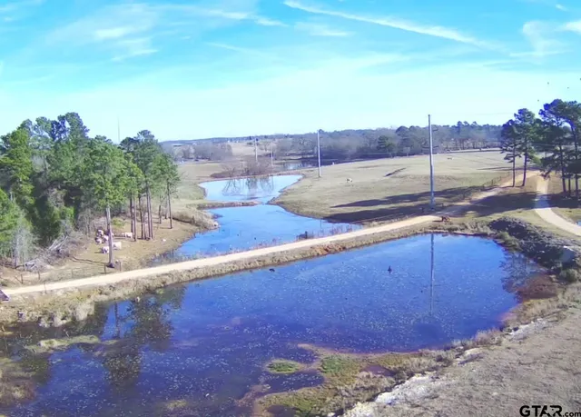 an aerial view of residential house and outdoor space