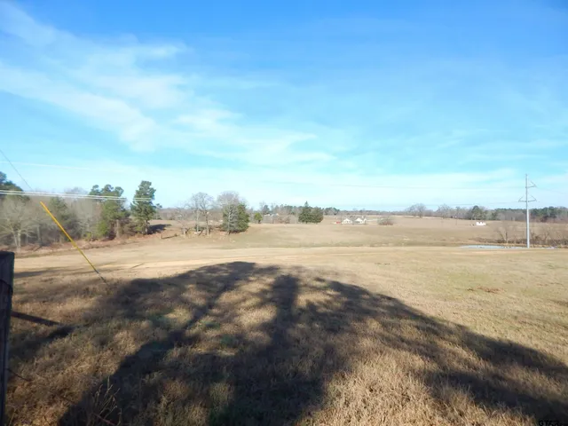 a view of a lake with houses in the back