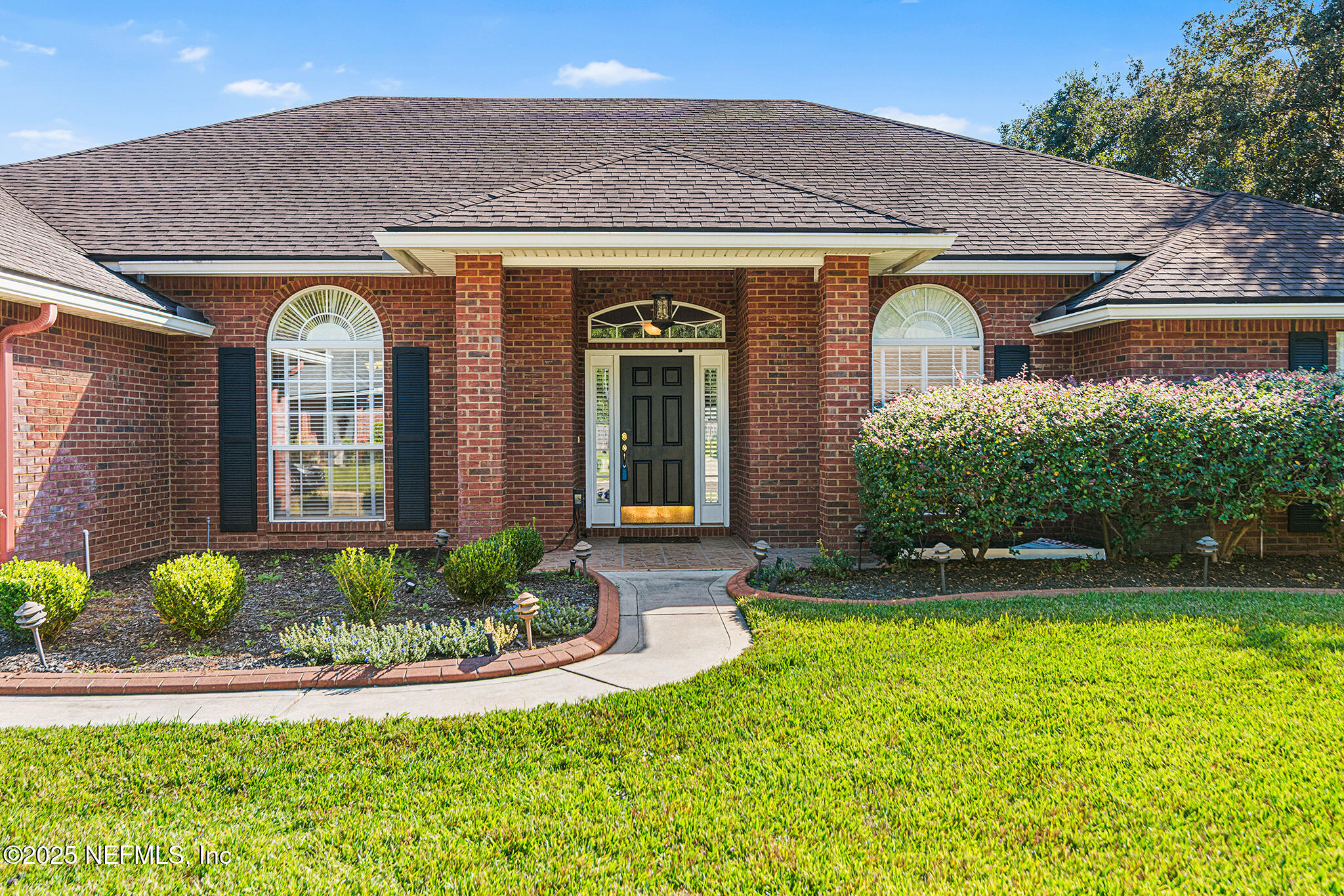 10922 Dunnotar Road Jacksonville, FL 32221 - Photo 1 of 35 a front view of a house with garden