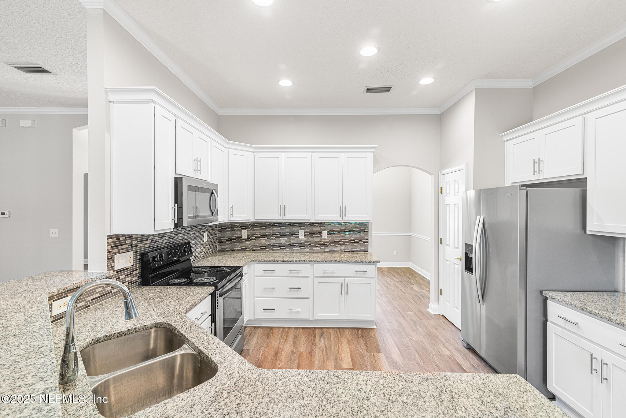 10922 Dunnotar Road Jacksonville, FL 32221 - Photo 14 of 35 a kitchen with a sink stove and refrigerator